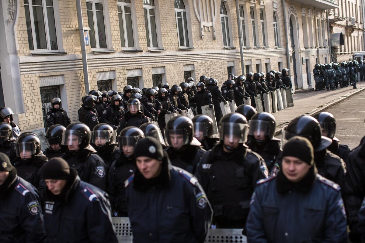 Police guard the presidential administration building in Kiev. Antigovernment protests continue in the Ukrainian capital.
