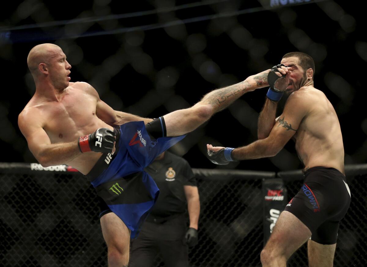 Donald Cerrone lands a kick to the head of Matt Brown during their UFC 206 bout on Dec. 11, 2016.