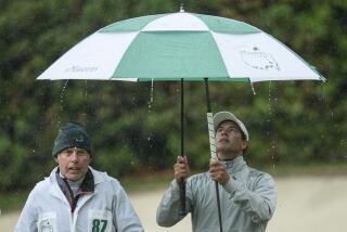 Adam Scott, of Australia, walks off the 13th green during the weather delayed third round of the Masters golf tournament at Augusta National Golf Club on Saturday, April 8, 2023, in Augusta, Ga. (AP Photo/Mark Baker)
