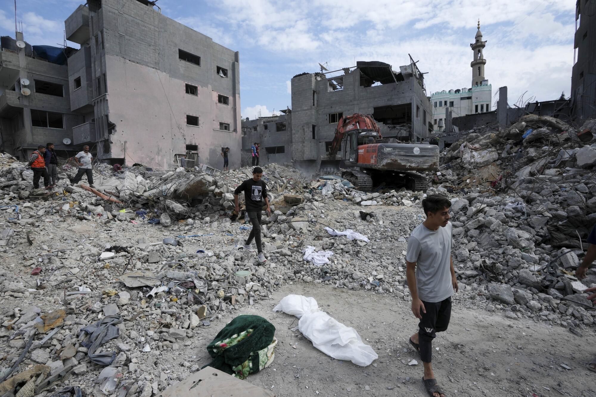 People recovering bodies of a family killed in Israeli bombardment of Gaza