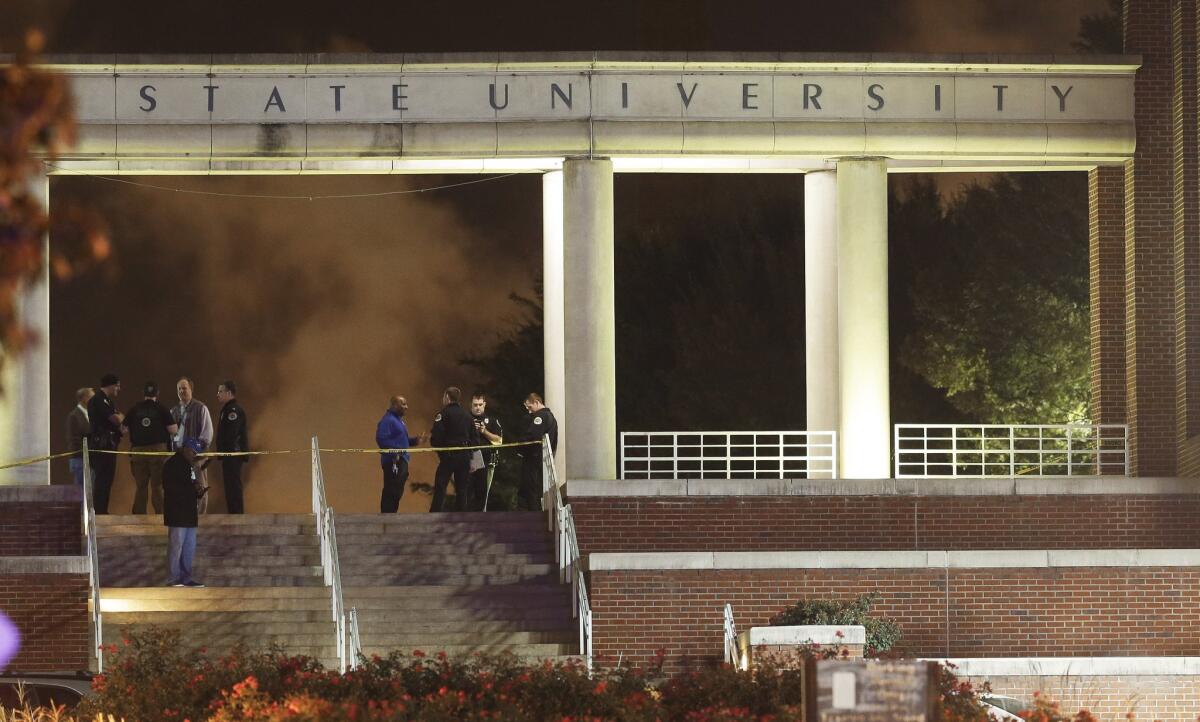 Officials investigate the scene of a shooting on the campus of Tennessee State University in Nashville on Oct. 23, 2015.
