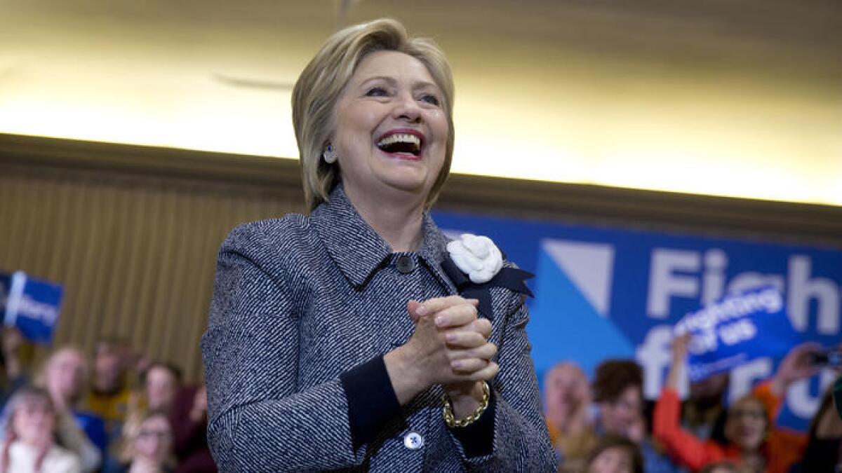 Hillary Clinton arrives at a campaign event with the Chicago Journeymen Local Plumbers Union.