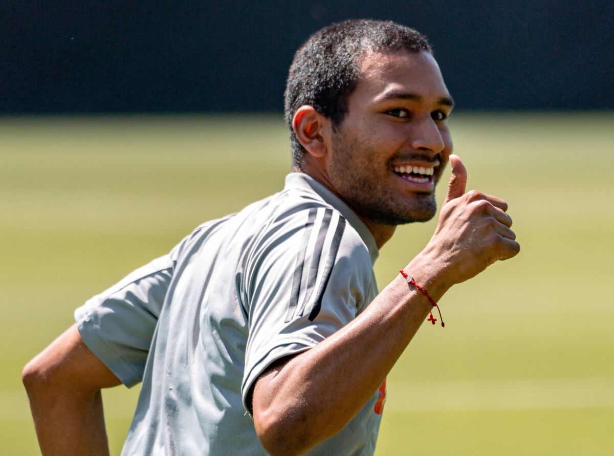 LAFC defender Eddie Segura smiles and gives a thumbs up while taking part in a training session on Thursday.