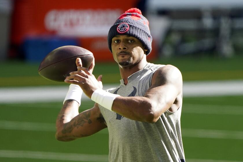 FILE - Houston Texans quarterback Deshaun Watson warms up before an NFL football game.