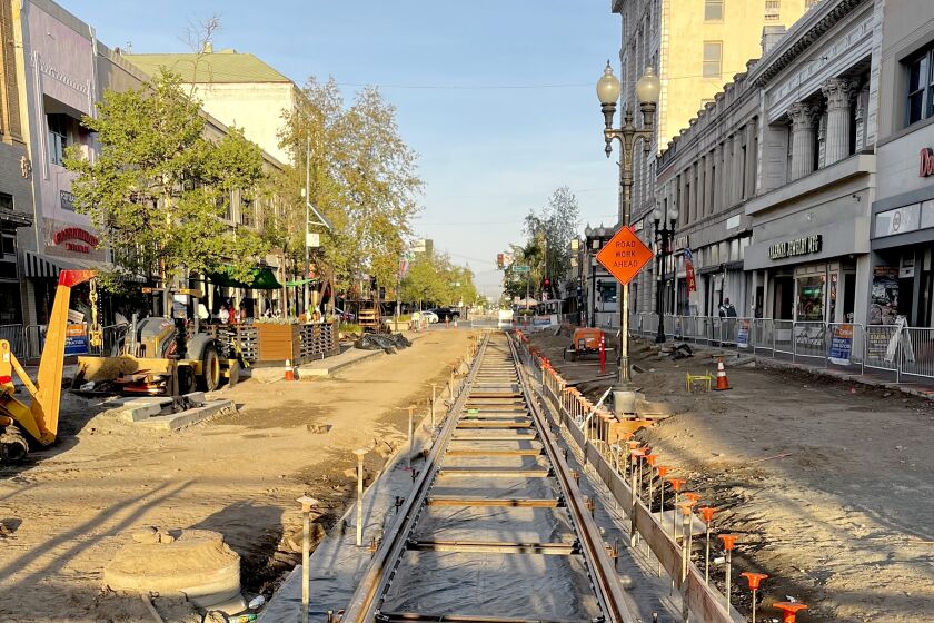 Track is laid as OC Streetcar construction continues along 4th Street in downtown Santa Ana. 