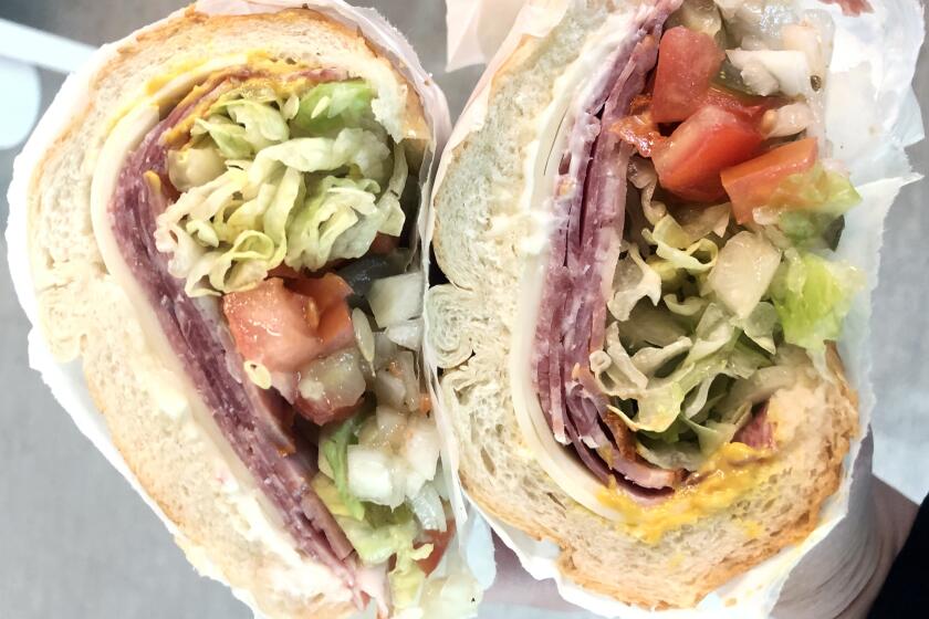 The Italian subs at Giamela's come with chopped tomato, onion and pickle.