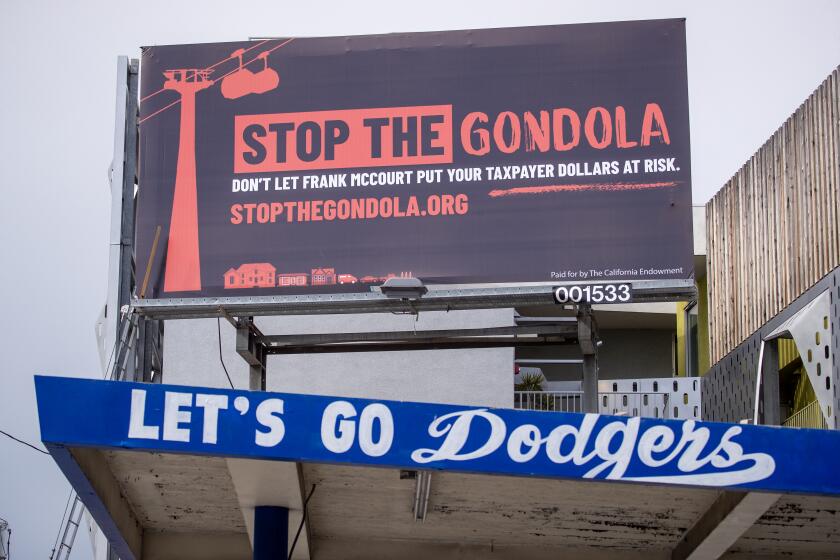 A billboard protests the gondola along Sunset Blvd. in Los Angeles Thursday, March 30, 2023. 