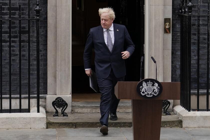 British Prime Minister Boris Johnson leaves 10 Downing Street, in London, Thursday, July 7, 2022. Johnson said Thursday he will remain as British prime minister while a leadership contest is held to choose his successor. (AP Photo/Alberto Pezzali)