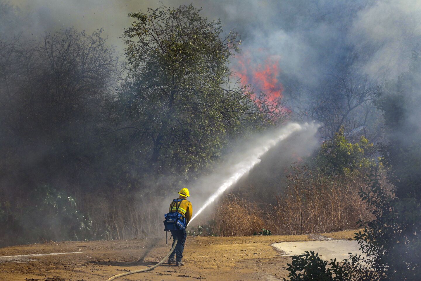 Orange County firefighters battle Blue Ridge fire along 3700 block of San Antonio in Yorba Linda