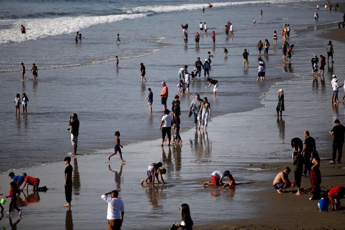 People along the waterfront at the Santa Monica beach on Christmas Day.