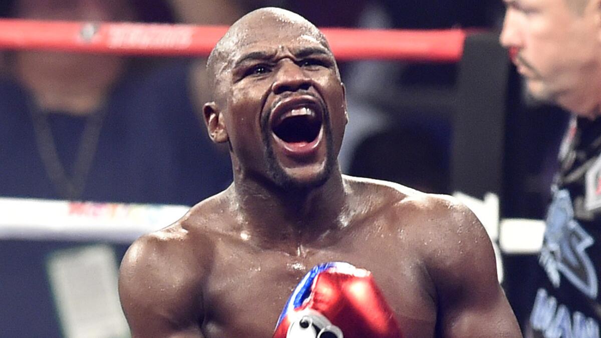 Floyd Mayweather Jr. celebrates after his victory by unanimous decision over Manny Pacquiao in a welterweight title fight at MGM Grand in Las Vegas in May.