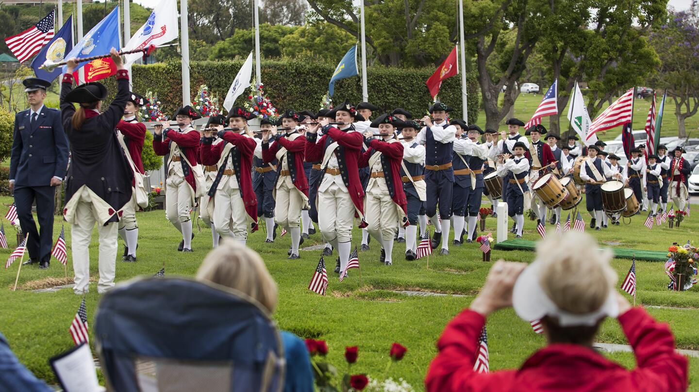 Mountain Fifes and Drums of Twin Peaks performs during the 59th annual Memorial Day service at Pacific View Memorial Park and Mortuary in Corona del Mar on Monday.