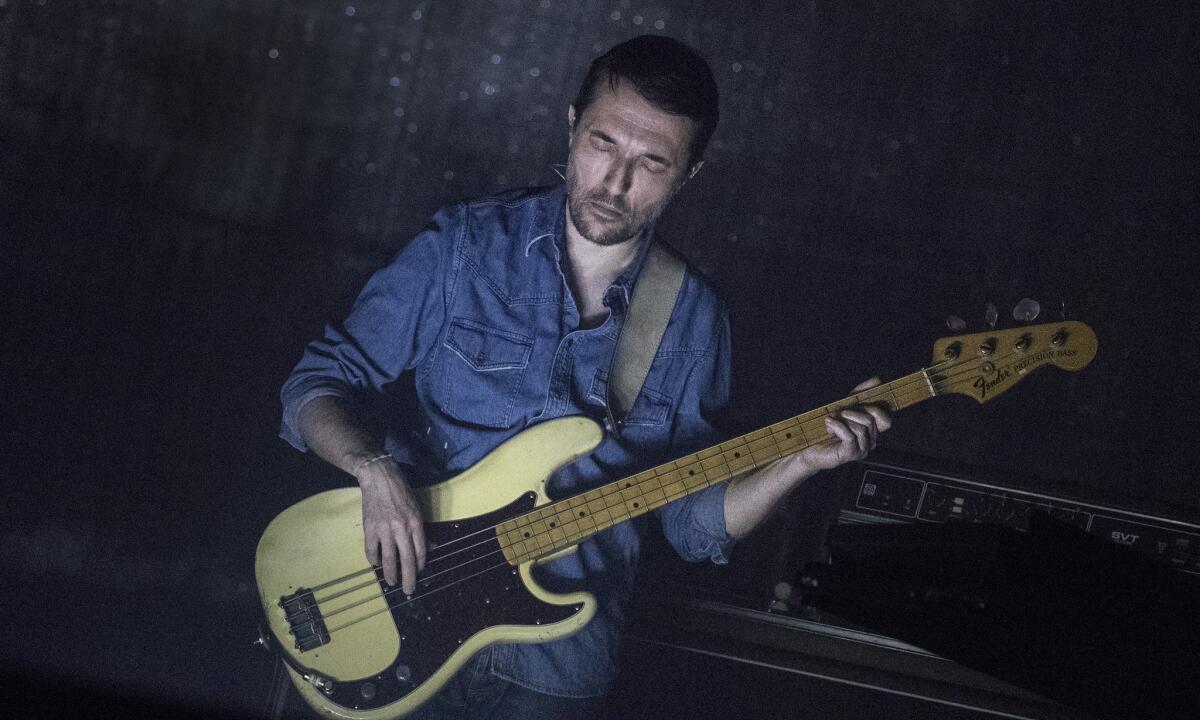 Radiohead bassist Colin Greenwood onstage at Coachella. (Brian van der Brug / Los Angeles Times)