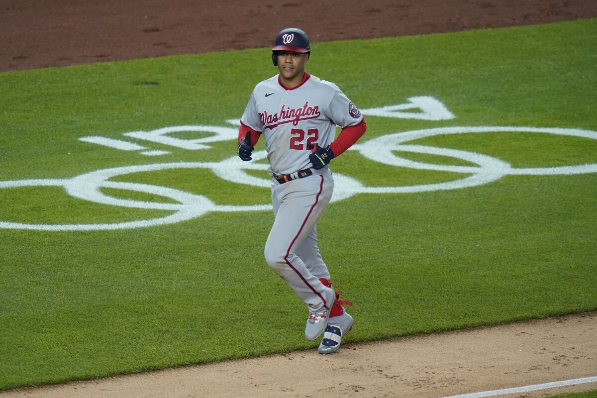 Washington Nationals' Juan Soto (22) runs the bases after hitting a two-run home run during the ninth inning of a baseball game against the New York Yankees, Friday, May 7, 2021, in New York. (AP Photo/Frank Franklin II)