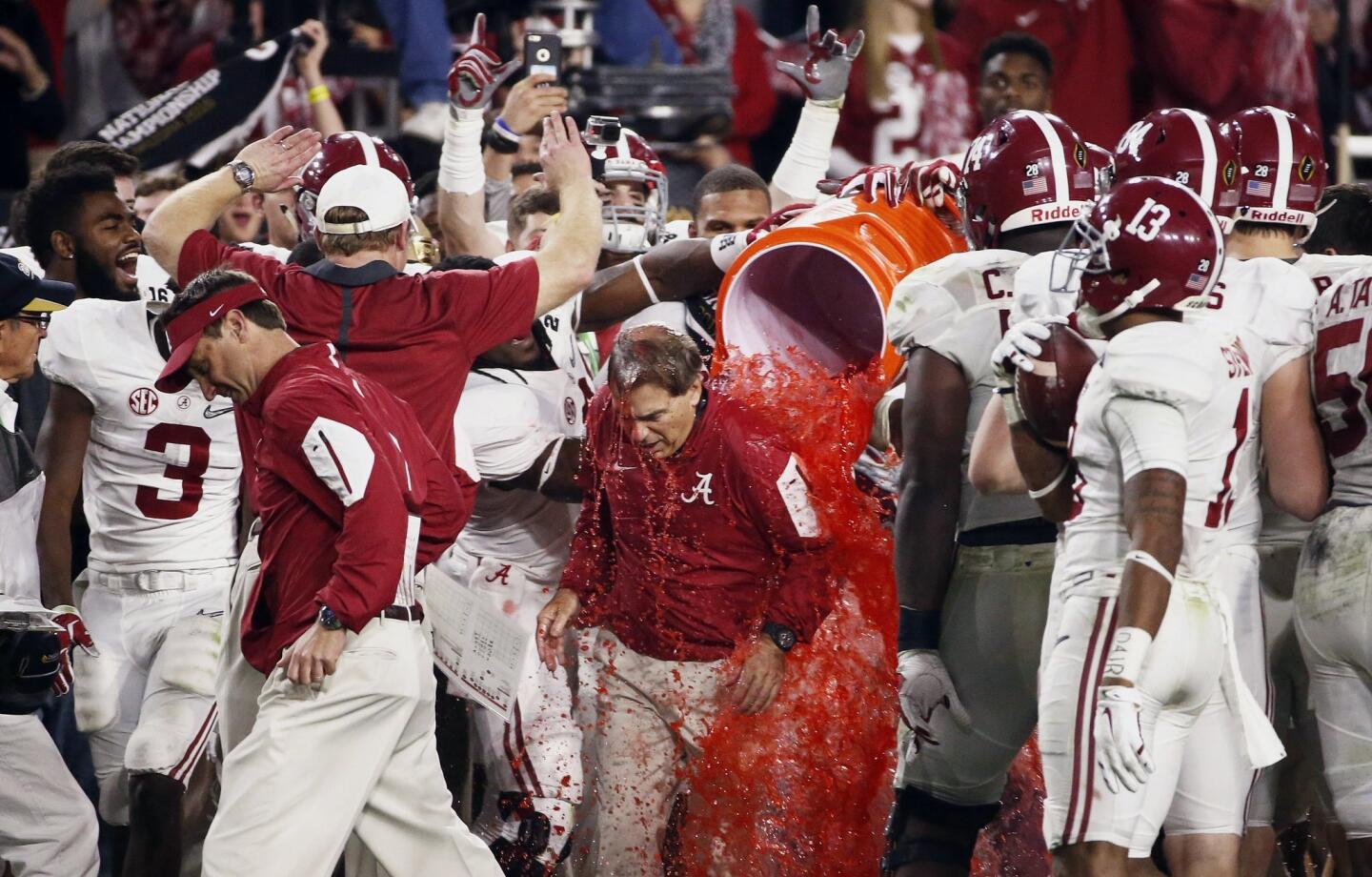 Alabama head coach Nick Saban gets doused after the NCAA college football playoff championship game against Clemson, Monday, Jan. 11, 2016, in Glendale, Ariz. Alabama won 45-40. (Rob Schumacher/The Arizona Republic via AP) MARICOPA COUNTY OUT; MAGS OUT; NO SALES; MANDATORY CREDIT