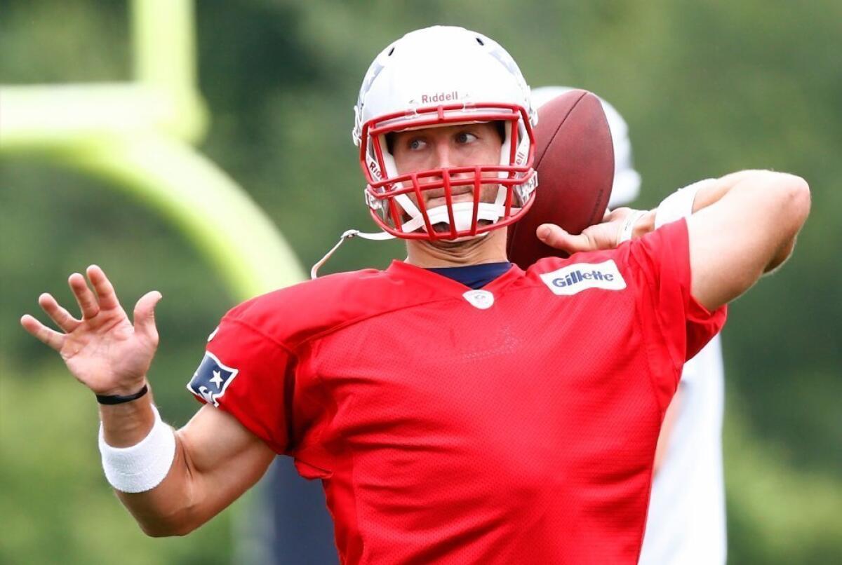 Tim Tebow throws at the Patriots' minicamp Tuesday.