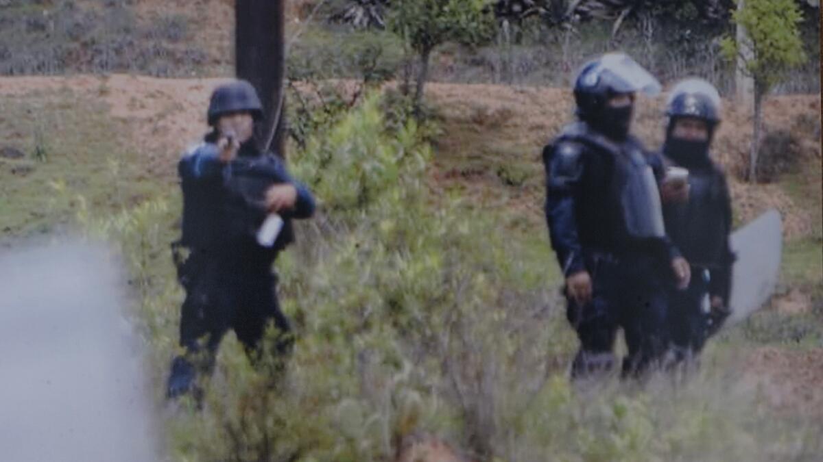 A photo found on the cellphone of Jesus Cadena Sanchez shows a federal policeman pointing his weapon during the unrest in Nochixtlan on June 19. (Jesus Cadena Sanchez)
