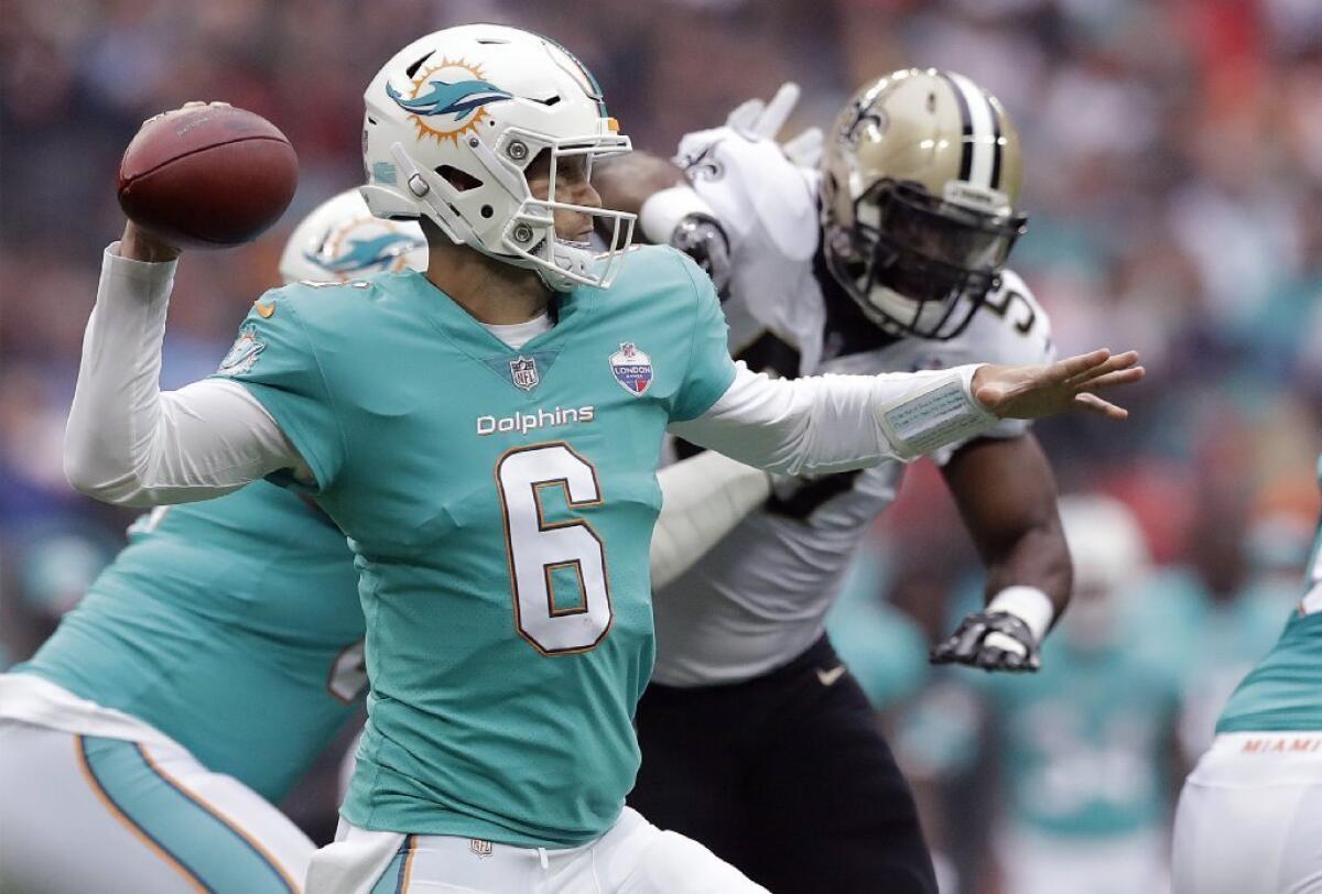 Miami Dolphins quarterback Jay Cutler looks to throw a pass during a game against the New Orleans Saints at Wembley Stadium in London on Oct. 1.