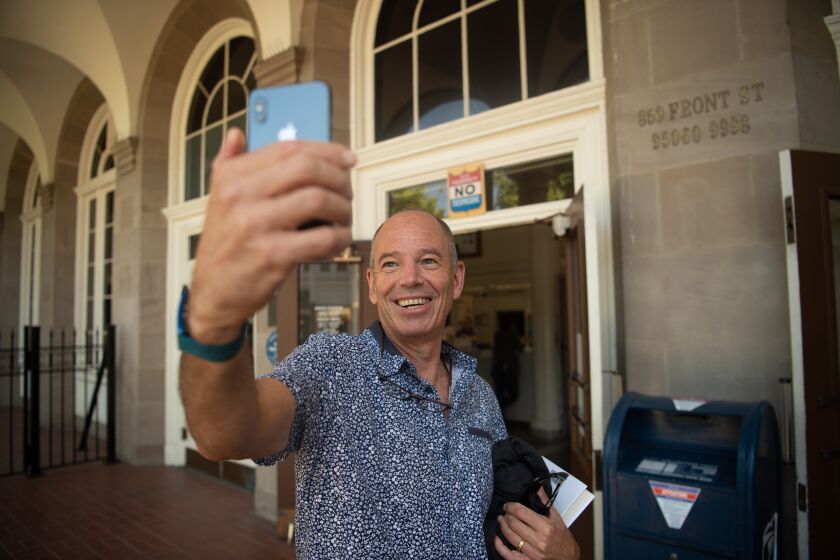 SANTA CRUZ, CA - SEPTEMBER 04, 2019 - Netflix Co-Founder and former CEO Marc Randolph takes a selfie at the post office where he tested out mailing DVDs in Santa Cruz, California on Sept. 04, 2019. (Josh Edelson/For the Times)