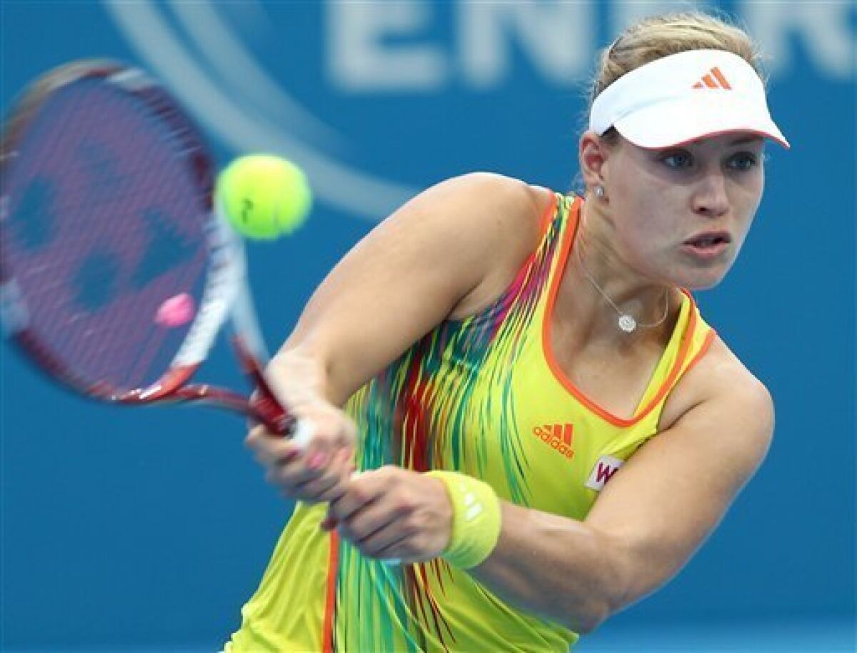 Angelique Kerber of Germany plays a shot in her 2nd round match against Monica Puig of Puerto Rico during the Brisbane International tennis tournament held in Brisbane, Australia, Wednesday, Jan 2, 2013. (AP Photo/Tertius Pickard).