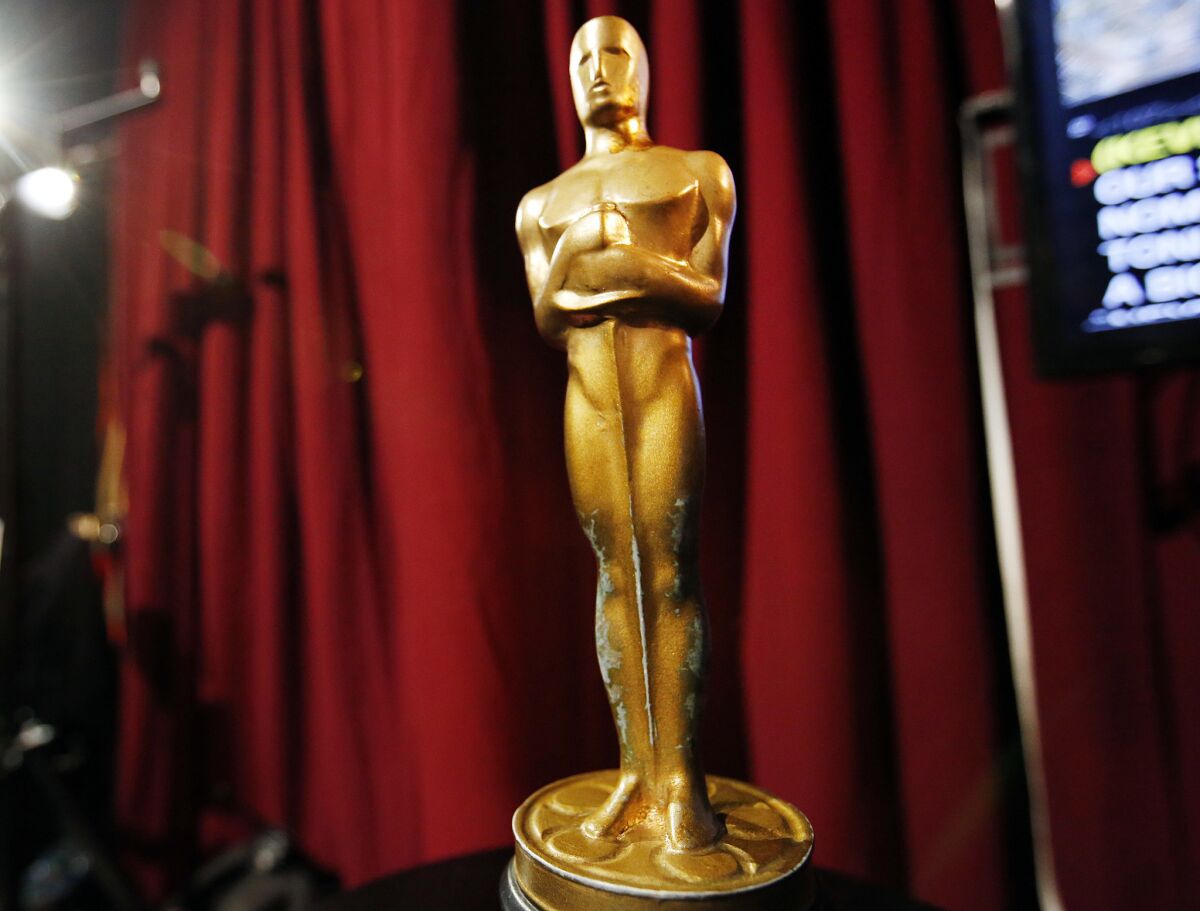 A wooden faux Oscar statue sits backstage at rehearsals in the Dolby Theatre for the 88th Academy Awards.