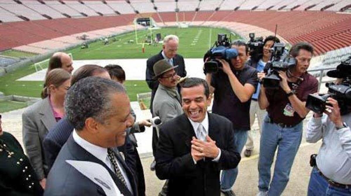 In April of 2006, Mayor Antonio Villaraigosa, center, Councilman Bernard Parks, left, and members of the Coliseum Commission toured the stadium and gave a news conference to discuss a presentation to the National Football League and stadium improvements.