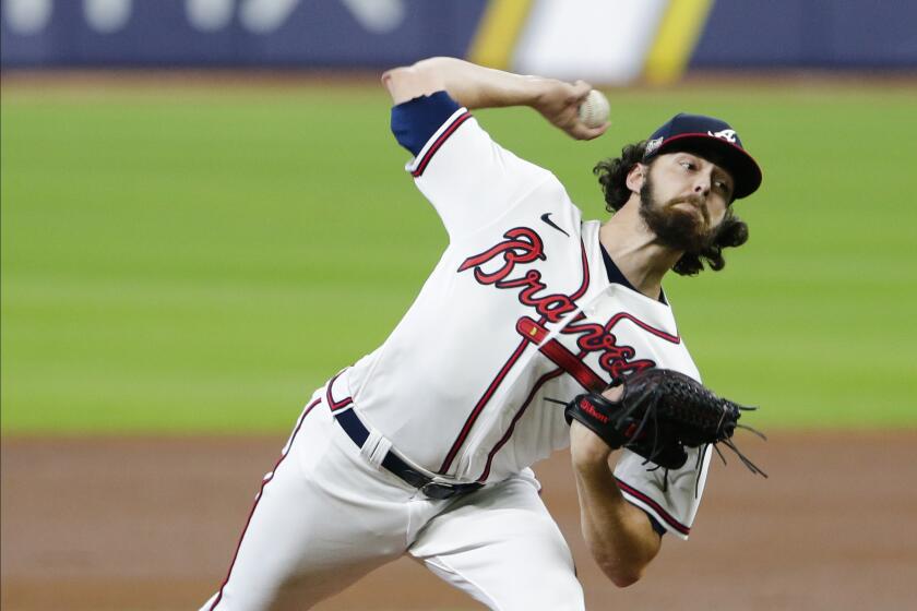 Atlanta Braves' Ian Anderson delivers a pitch during the second inning in Game 2 of a baseball National League Division Series against the Miami Marlins Wednesday, Oct. 7, 2020, in Houston. (AP Photo/Michael Wyke)