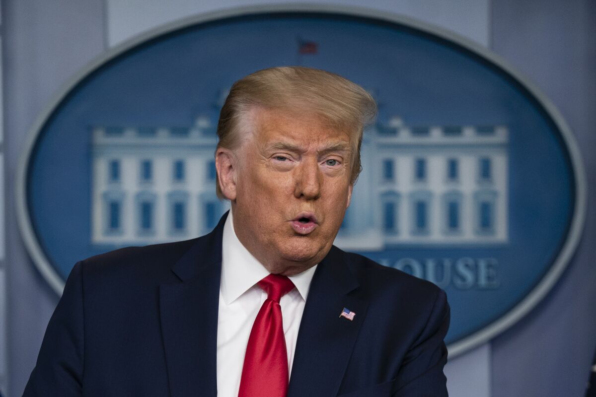 President Trump speaks during a news briefing at the White House.
