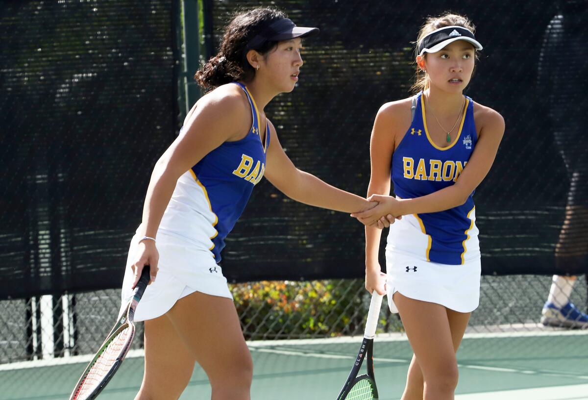 Fountain Valley's Anh Thu Truong, left, and Rene Do shake hands after winning a point during Friday's CIF title match.