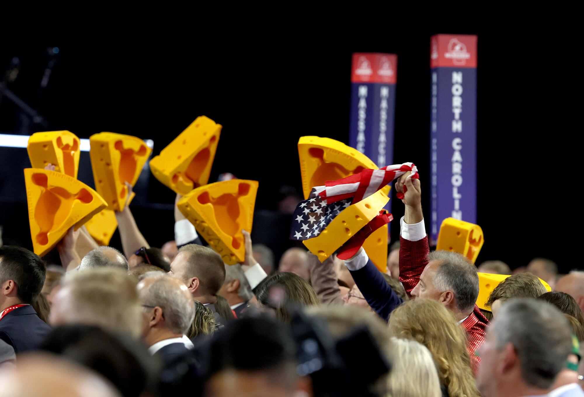 Wisconsin delegates raise their cheese hats on the final day og the Republican National Convention.