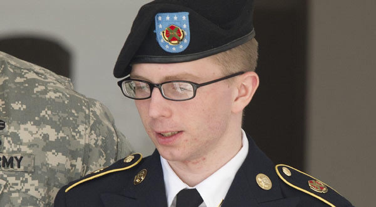 Bradley Manning is escorted by military police as he departs the courtroom at Fort Meade, Md., in this file photo.