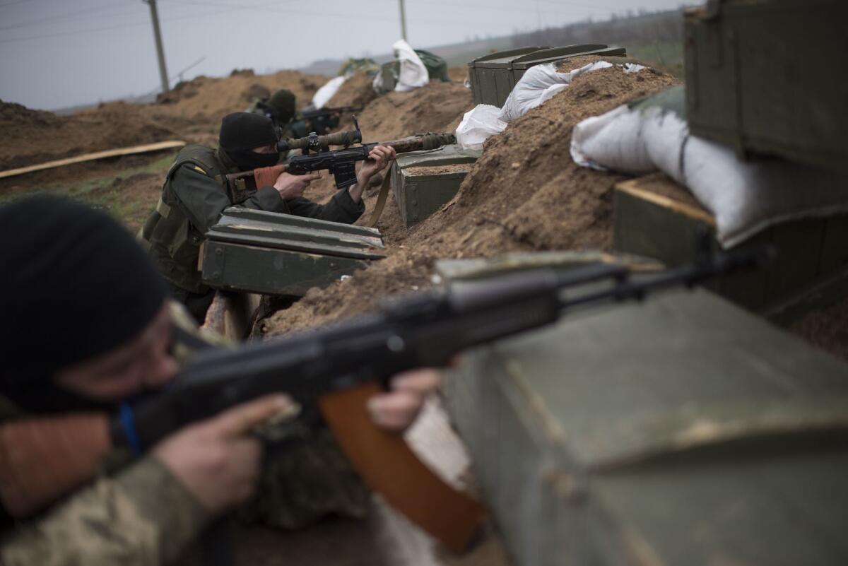Ukrainian servicemen guard their position in the village of Berdyanske near Shyrokyne, eastern Ukraine, on April 14.