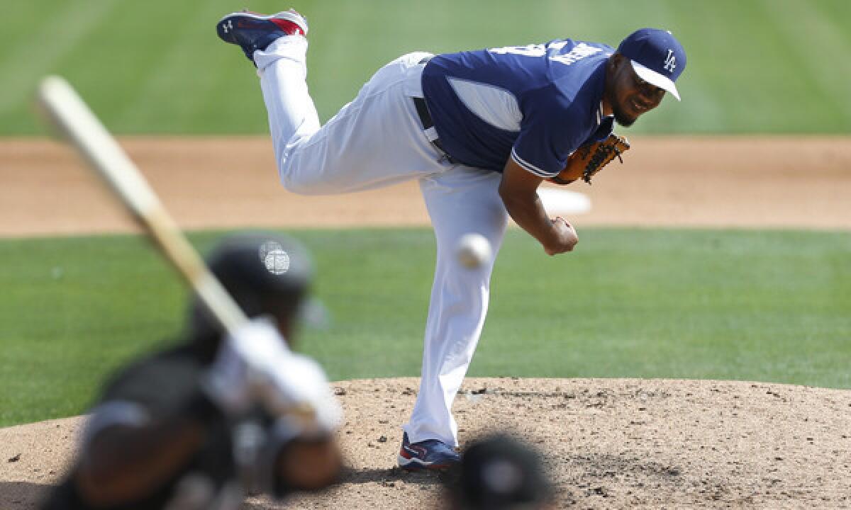 Dodgers closer Kenley Jansen delivers a pitch during an exhibition game against the Chicago White Sox on Feb. 28. Jansen threw a scoreless inning in the Dodgers' Cactus League win Saturday over the San Diego Padres.