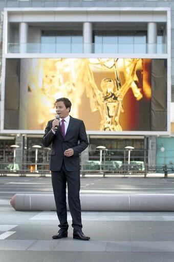The Emmys host talks to the media during the official red carpet rollout outside the Nokia Theatre at L.A. Live in downtown Los Angeles on Wednesday, Aug.25. Panoramic views: The stage | Governors Ball | Governors Ball table setting