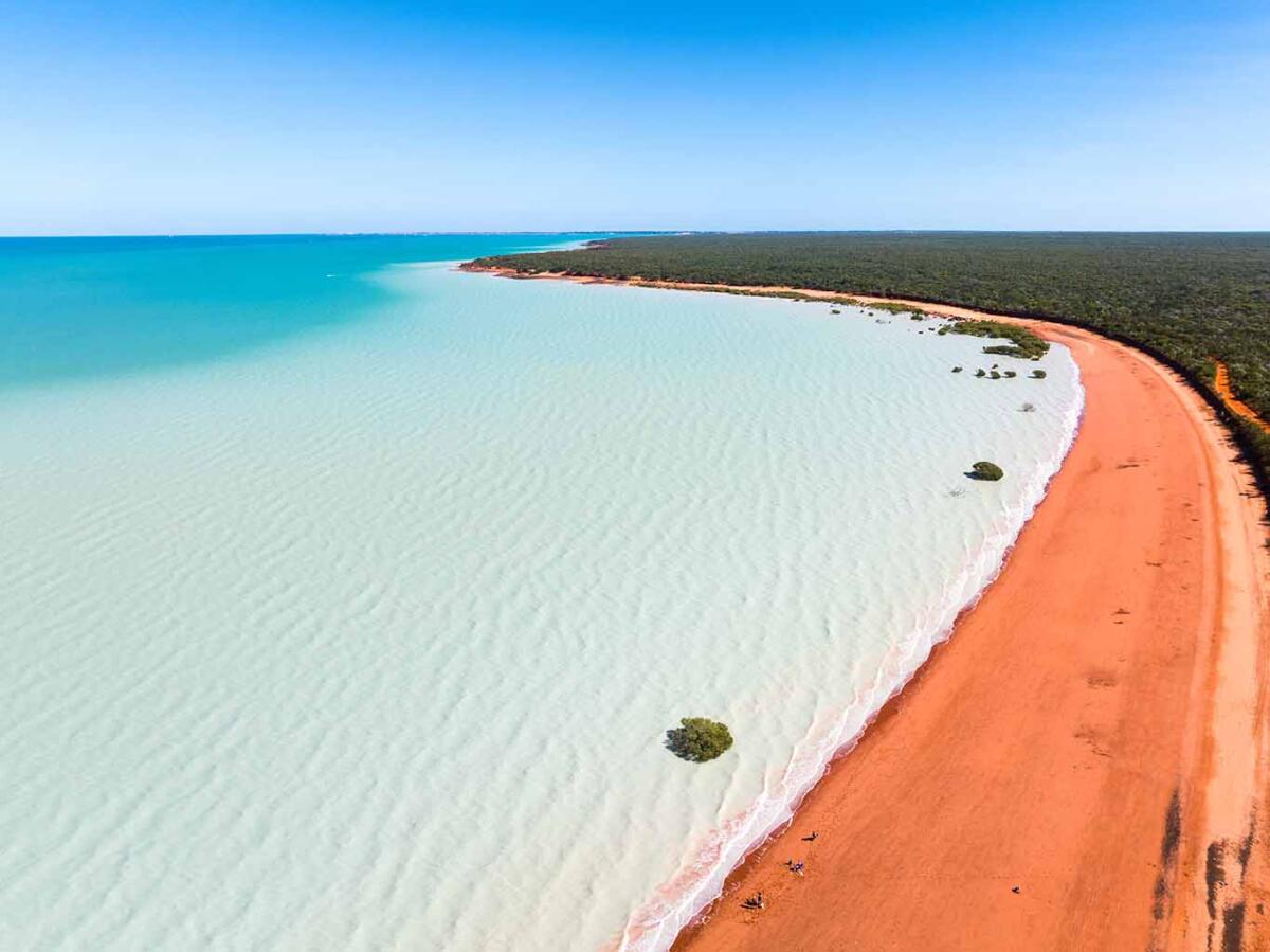 Aerial view of red sandy coastline at Red Sand Beach, Roebuck Bay, Broome, Western Australia