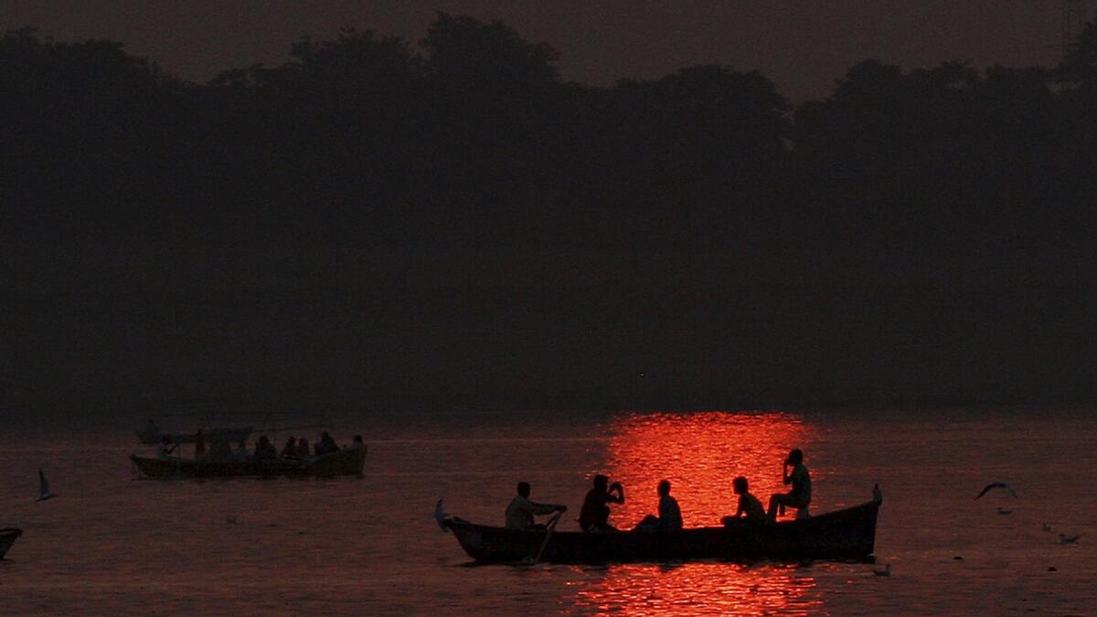 Hindu pilgrims take boat rides at sunset in the northern Indian city of Allahabad near the confluence of the Ganges and Yamuna rivers.