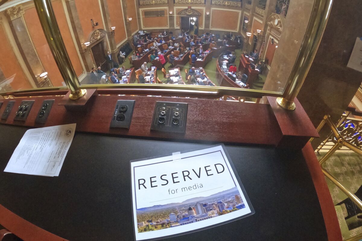 A table reserved for the media is shown above floor to the Utah House of Representatives on Tuesday, March 1, 2022, in Salt Lake City. The Utah House of Representatives approved new rules on Tuesday that limit where members of the press can film and interview lawmakers, following similar action taken by the Utah Senate weeks ago. (AP Photo/Rick Bowmer)