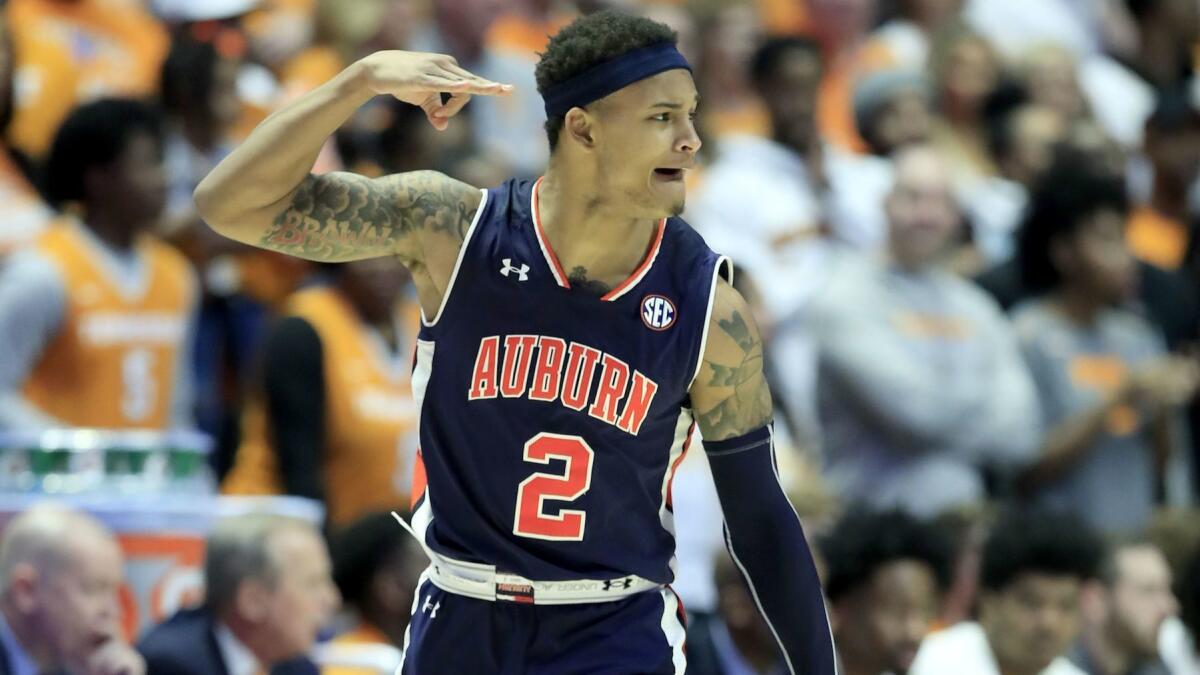 Bryce Brown celebrates after making a three-pointer against Tennessee in the SEC tournament championship game.
