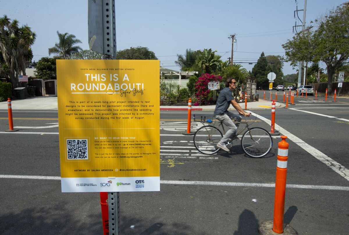 A bicyclist rides through an intersection at 19th St. and Monrovia ave. in Costa Mesa 