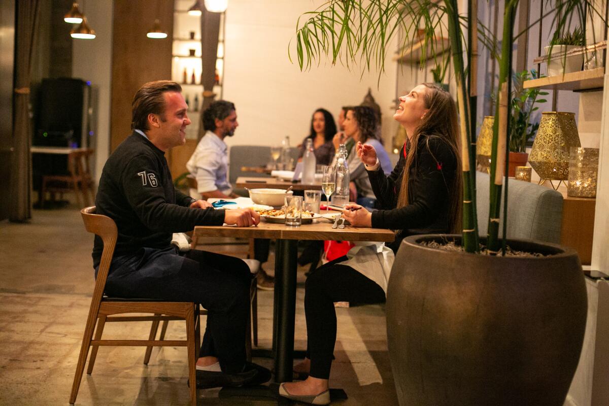 Patrons enjoy dinner at Cassia as the much loved restaurant reopens its indoor dining room.