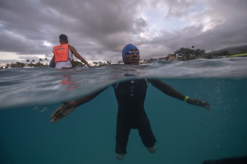 Challenged triathlete Roderick Sewell at the swim start of the Ironman World Championship in Hawaii on Oct. 12. He is the first double-leg, above-knee amputee to finish the Ironman World on prosthetic legs.