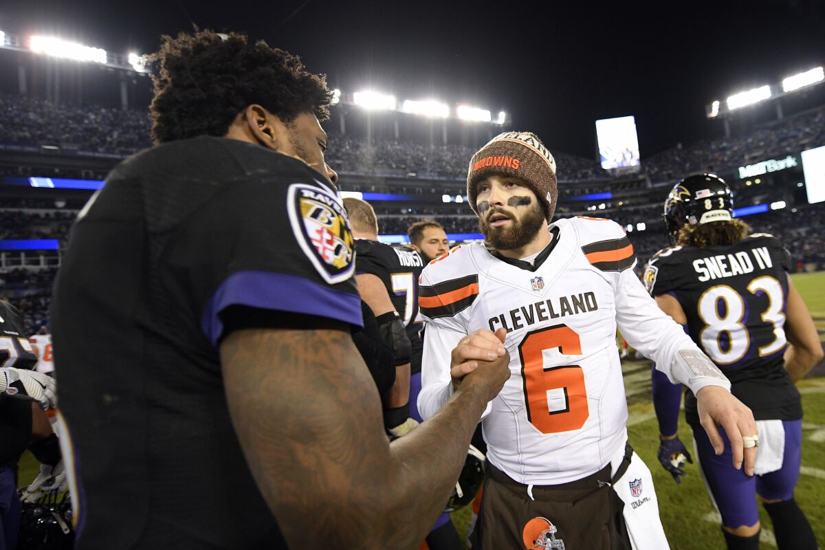 FILE - Cleveland Browns quarterback Baker Mayfield, right, speaks with Baltimore Ravens quarterback Lamar Jackson after an NFL football game, Sunday, Dec. 30, 2018, in Baltimore. Baltimore won 26-24. The Ravens play at the Cleveland Browns on Sunday, Sept. 13, 2020. (AP Photo/Nick Wass, File)
