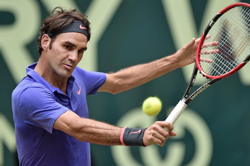 Roger Federer hits a return during his victory over Andreas Seppi for the Gerry Weber Open title on Sunday.