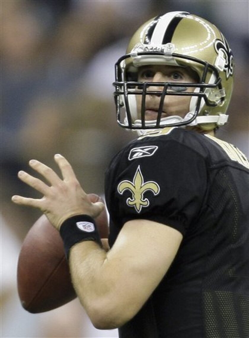 New Orleans Saints quarterback Drew Brees looks downfield against the Green Bay Packers in the second half of an NFL football game in New Orleans, Monday, Nov. 24, 2008. (AP Photo/Alex Brandon)