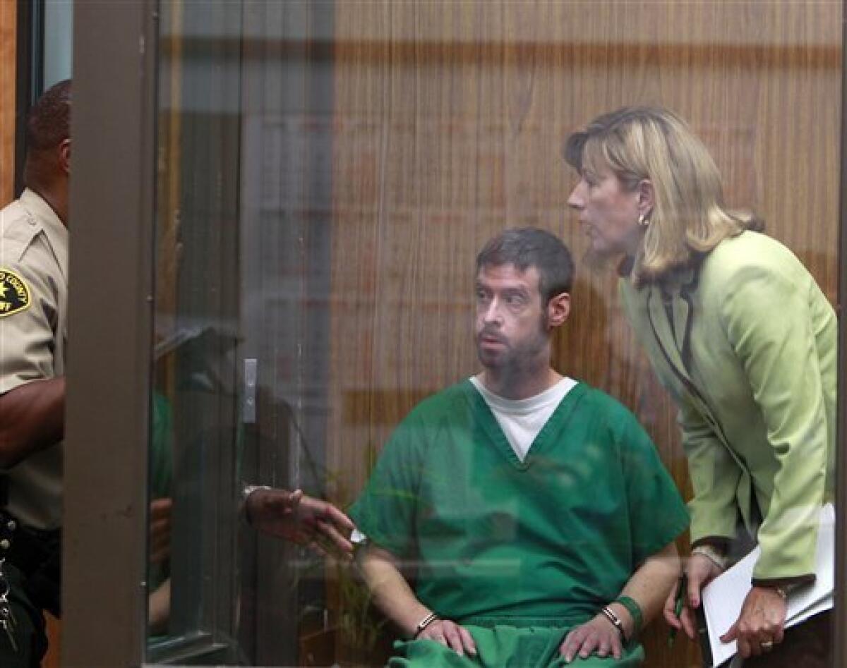 Brendan Liam O'Rourke and his attorney, Kathleen Cannon, receive instructions from a baliff as they wait in a holding area in a San Diego Superior Courtroom where O'Rourke was arraigned on attempted murder charges stemming from an incident at the Kelly Elementary School in Carlsbad, Calif. Wednesday, Oct. 13, 2010, in Vista Calif. (AP Photo/Lenny Ignelzi)