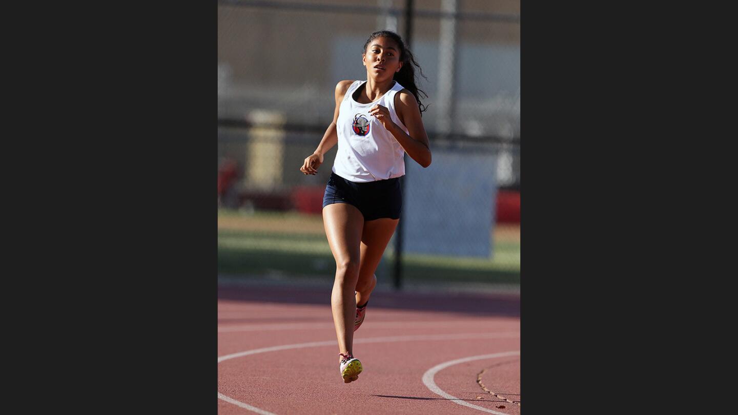 Bell-Jeff's Caitlyn Couch leads the entire 1600 meter race to win in the Santa Fe League track finals at Burroughs High School on Wednesday, May 3, 2017.