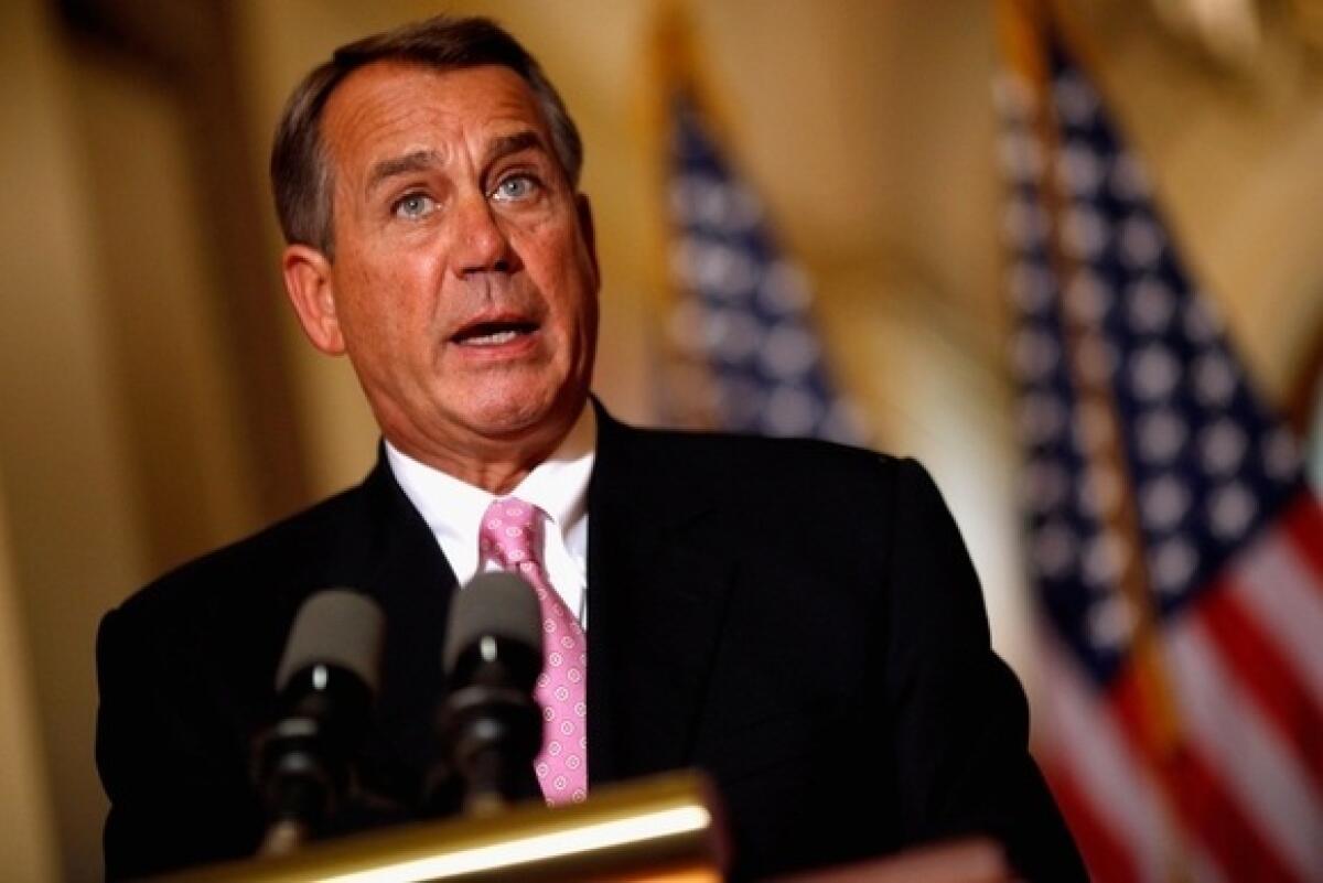 House Speaker John Boehner holds a news briefing outside his offices at the Capitol.