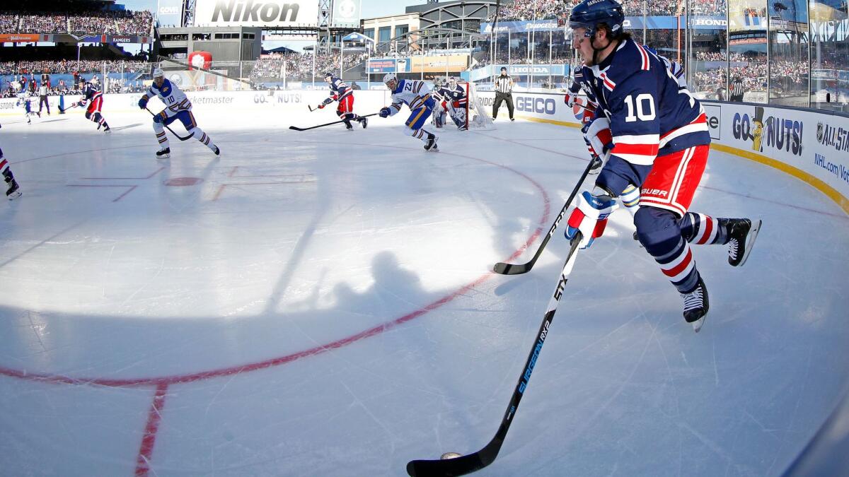 New York Rangers left wing J.T. Miller controls the puck against the Buffalo Sabres in the Winter Classic at CitiField on New Year's Day 2018.