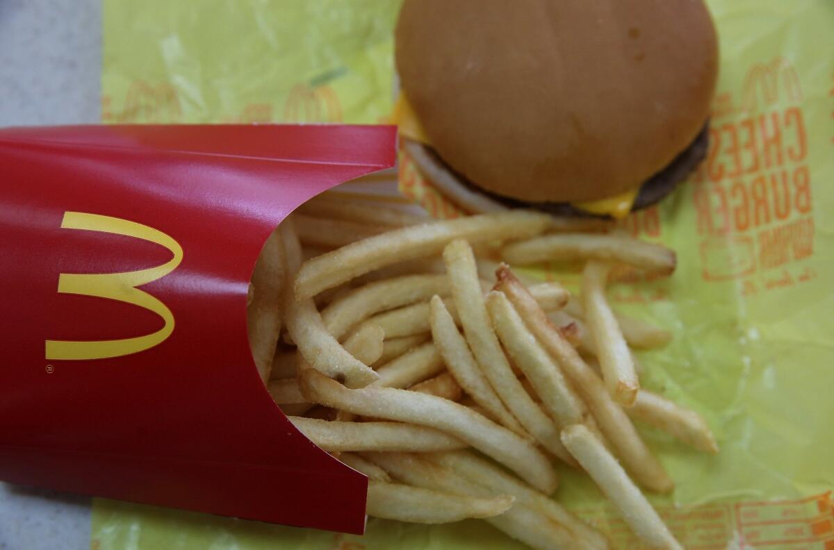 A McDonald's cheeseburger and fries.