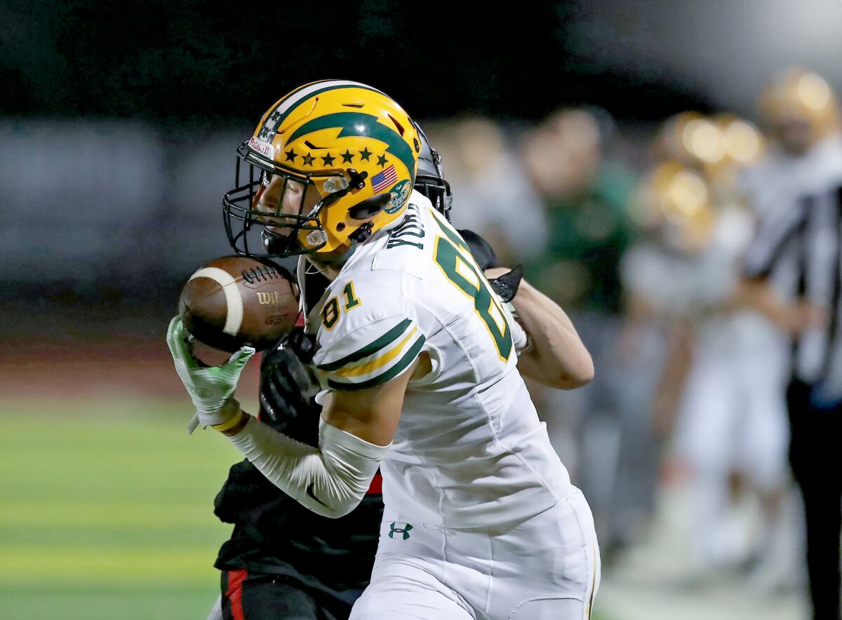 Edison receiver Mason York reels in a catch for a big gain in the third quarter Friday night against San Clemente.